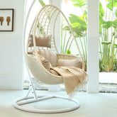 Metal porch swing with tropical olive green, auburn, and rose cushions, includes stand and chain